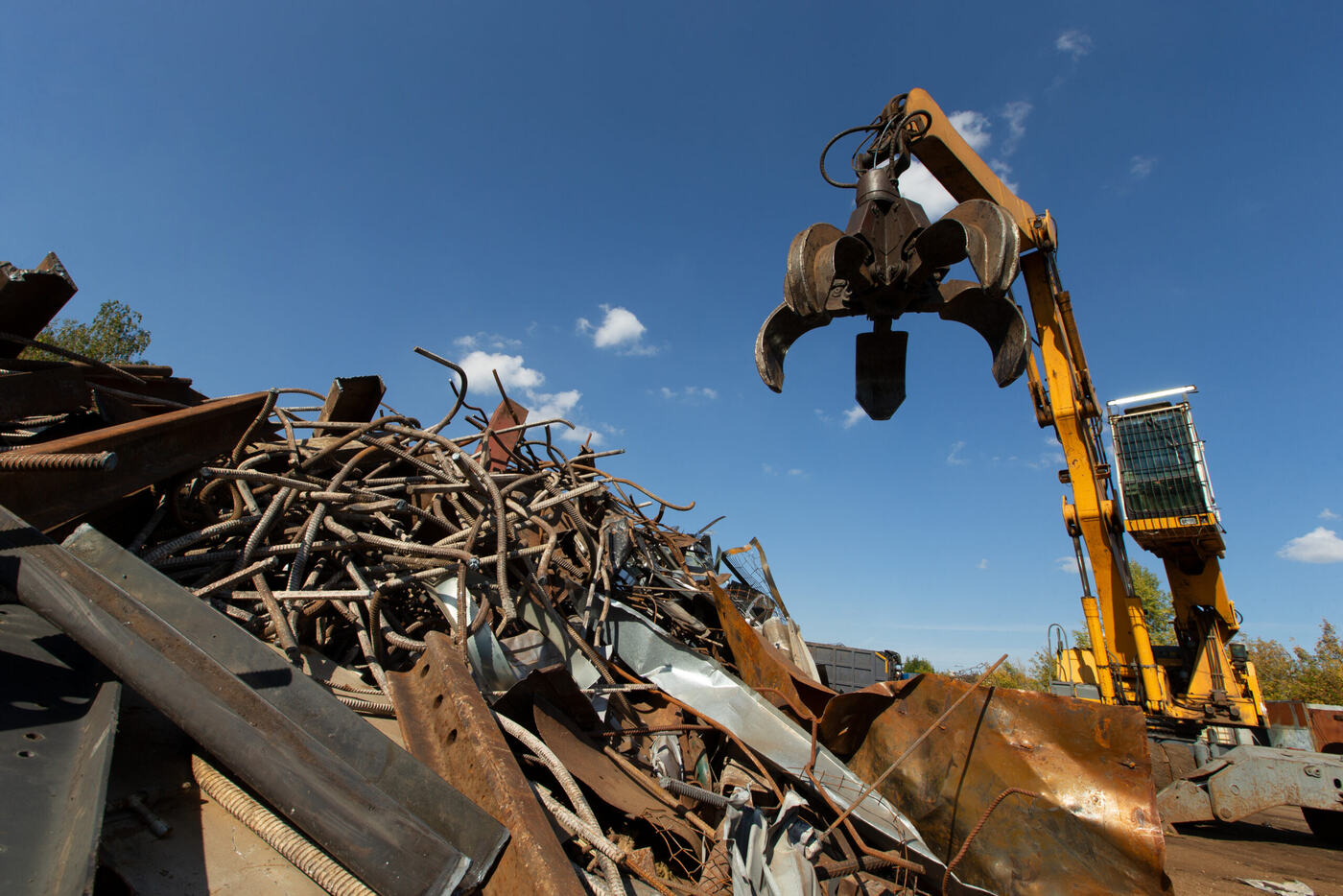 Heavy equipment loading construction and demolition debris